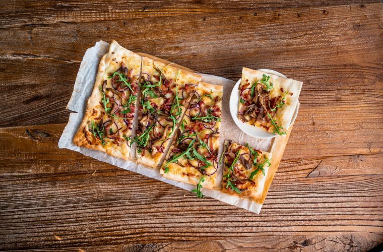 Flammkuchen with bacon, onion, and oyster mushrooms